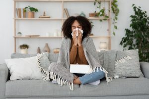 Office cleaners sanitizing desks and high touch points to support workplace health