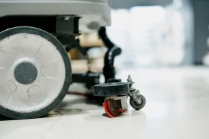 Technician maintaining commercial lobby flooring in Winnipeg building