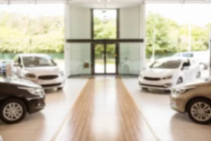 Commercial cleaning inside a Calgary automotive dealership showroom and service bay