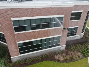 Drone window cleaning on a Calgary commercial building with limited roof access