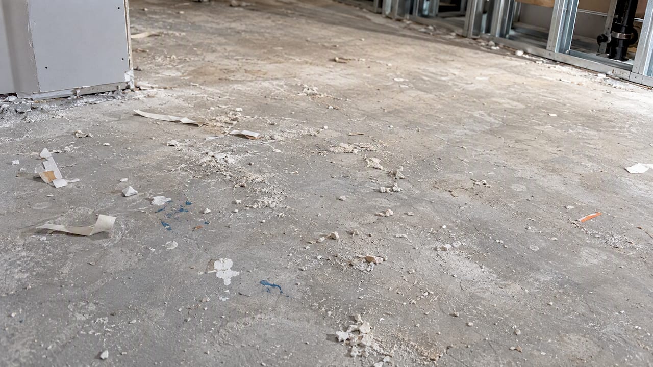 Dust and trade debris on gypcrete underlayment